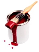 Pot of red paint with paintbrush